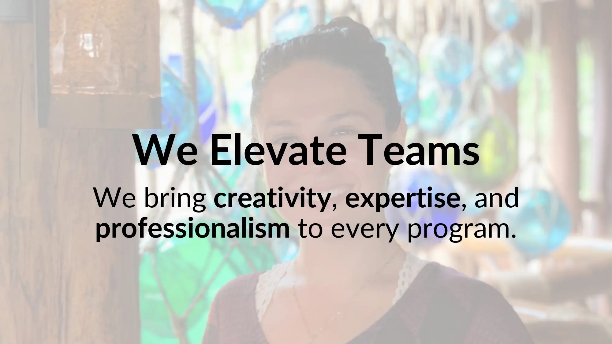 We Elevate Teams over blurred background.