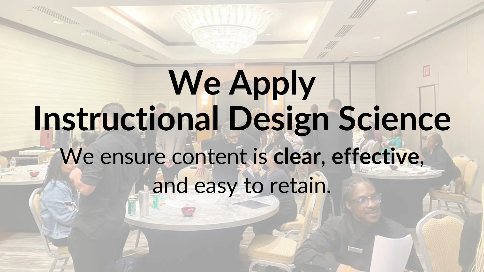 People gathered in a conference room setting.