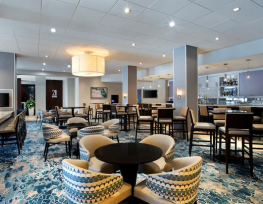 Modern hotel lounge with stylish seating arrangement.